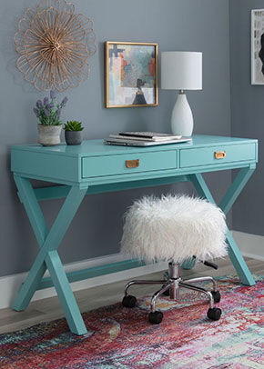 image of bright blue desk with small stool